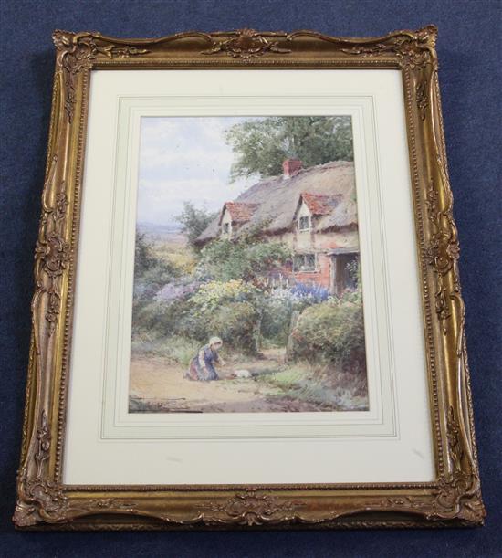 Henry Sylvester Stannard (1870-1951) Girl with a kitten beside a thatched cottage 13.75 x 9.75in.